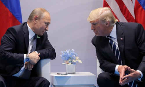 Tổng thống Nga Vladimir Putin (trái) và người đồng cấp Donald Trump. Ảnh: Reuters.