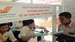 Vi phạm giao thông đường bộ, có thể nhờ Bưu điện nộp phạt?